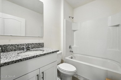 Discover the exceptional value of this pristine 2023 DR Horton on Halifax Plantation Golf Club in Florida - for sale on GolfHomes.com, golf home, golf lot
