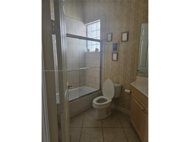 Enter through a private entrance to a peacefully courtyard with on Kensington Golf and Country Club in Florida - for sale on GolfHomes.com, golf home, golf lot