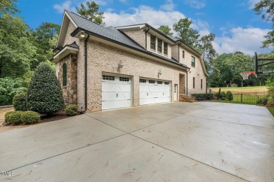 Experience luxury living in this stunning executive home located on MacGregor Downs Country Club in North Carolina - for sale on GolfHomes.com, golf home, golf lot
