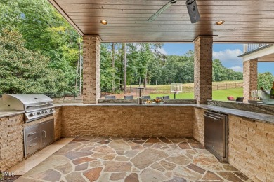 Experience luxury living in this stunning executive home located on MacGregor Downs Country Club in North Carolina - for sale on GolfHomes.com, golf home, golf lot