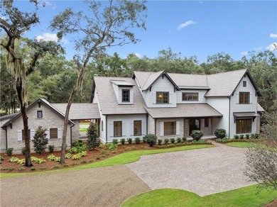 Incredible golf course, lake, and marsh views from one of the on Frederica Golf Club in Georgia - for sale on GolfHomes.com, golf home, golf lot