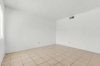 Welcome home to this charming 2-bedroom, 1.5-bath townhome on Raven Golf Club At South Mountain in Arizona - for sale on GolfHomes.com, golf home, golf lot