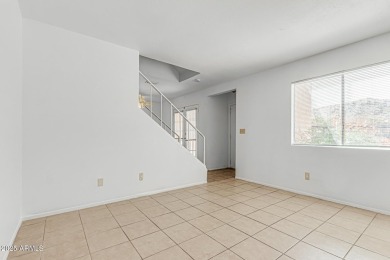 Welcome home to this charming 2-bedroom, 1.5-bath townhome on Raven Golf Club At South Mountain in Arizona - for sale on GolfHomes.com, golf home, golf lot
