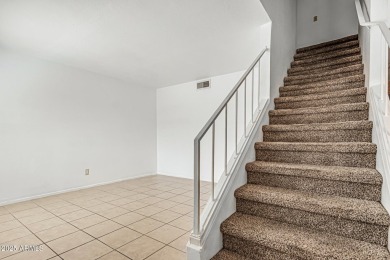 Welcome home to this charming 2-bedroom, 1.5-bath townhome on Raven Golf Club At South Mountain in Arizona - for sale on GolfHomes.com, golf home, golf lot