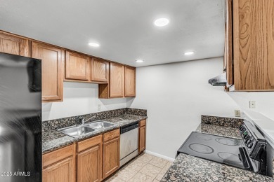 Welcome home to this charming 2-bedroom, 1.5-bath townhome on Raven Golf Club At South Mountain in Arizona - for sale on GolfHomes.com, golf home, golf lot