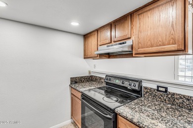 Welcome home to this charming 2-bedroom, 1.5-bath townhome on Raven Golf Club At South Mountain in Arizona - for sale on GolfHomes.com, golf home, golf lot