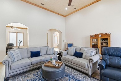 Poised beneath a canopy of mature trees on a gorgeous one-acre on Sugar Tree Golf and Country Club in Texas - for sale on GolfHomes.com, golf home, golf lot