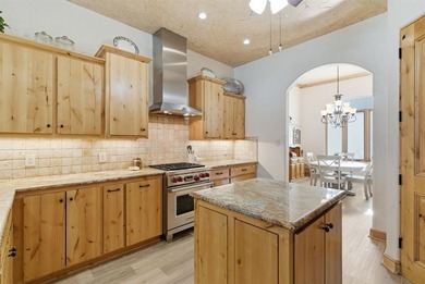 Poised beneath a canopy of mature trees on a gorgeous one-acre on Sugar Tree Golf and Country Club in Texas - for sale on GolfHomes.com, golf home, golf lot