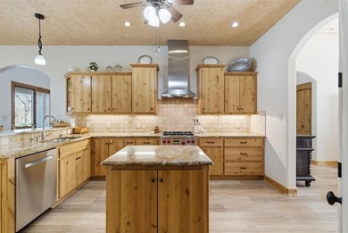 Poised beneath a canopy of mature trees on a gorgeous one-acre on Sugar Tree Golf and Country Club in Texas - for sale on GolfHomes.com, golf home, golf lot