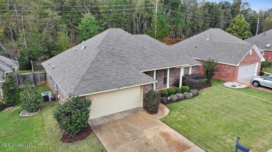 Discover this inviting 3-bedroom, 2-bathroom split-plan home in on Patrick Farms Golf Club in Mississippi - for sale on GolfHomes.com, golf home, golf lot