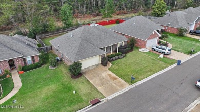 Discover this inviting 3-bedroom, 2-bathroom split-plan home in on Patrick Farms Golf Club in Mississippi - for sale on GolfHomes.com, golf home, golf lot