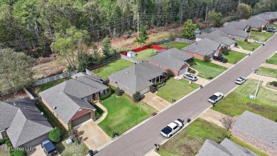 Discover this inviting 3-bedroom, 2-bathroom split-plan home in on Patrick Farms Golf Club in Mississippi - for sale on GolfHomes.com, golf home, golf lot