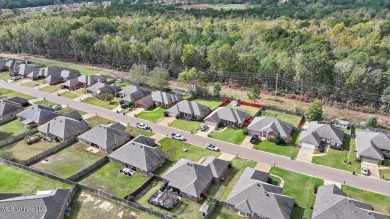 Discover this inviting 3-bedroom, 2-bathroom split-plan home in on Patrick Farms Golf Club in Mississippi - for sale on GolfHomes.com, golf home, golf lot