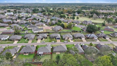 Discover this inviting 3-bedroom, 2-bathroom split-plan home in on Patrick Farms Golf Club in Mississippi - for sale on GolfHomes.com, golf home, golf lot