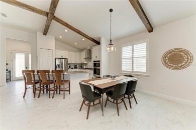 Come home to easy living, casual elegance, and soothing views on IMG Academies Golf and Country Club in Florida - for sale on GolfHomes.com, golf home, golf lot