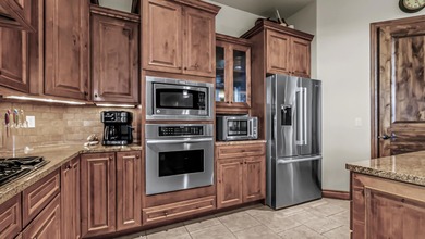 Set high above the 9th hole in Redlands Mesa, 324 Iron Horse Ct on The Golf Club At Redlands Mesa in Colorado - for sale on GolfHomes.com, golf home, golf lot