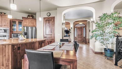 Set high above the 9th hole in Redlands Mesa, 324 Iron Horse Ct on The Golf Club At Redlands Mesa in Colorado - for sale on GolfHomes.com, golf home, golf lot