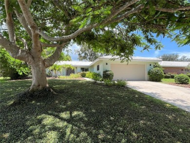 Beautifully Updated GOLF COURSE Frontage Home with the ABSOLUTE on Village Green Golf Club of Sarasota in Florida - for sale on GolfHomes.com, golf home, golf lot