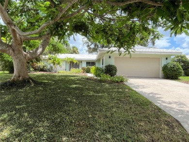 Beautifully Updated GOLF COURSE Frontage Home with the ABSOLUTE on Village Green Golf Club of Sarasota in Florida - for sale on GolfHomes.com, golf home, golf lot
