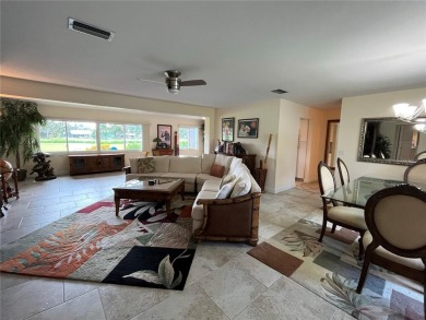 Beautifully Updated GOLF COURSE Frontage Home with the ABSOLUTE on Village Green Golf Club of Sarasota in Florida - for sale on GolfHomes.com, golf home, golf lot