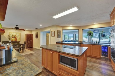 Unforgettable 5-bed, 3-bath gem at the end of a quiet cul-de-sac on Jacaranda Golf Club in Florida - for sale on GolfHomes.com, golf home, golf lot