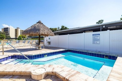 STUNNING CONDO IN COVE CAY! Welcome to this charming 2-bedroom on Cove Cay Country Club in Florida - for sale on GolfHomes.com, golf home, golf lot