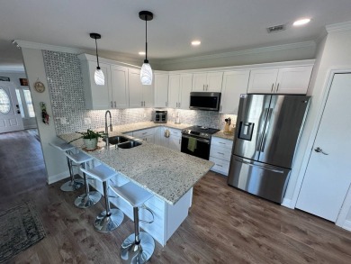 A beautiful remodeled home done in 2022! As you arrive at the on Del Tura Golf and Country Club in Florida - for sale on GolfHomes.com, golf home, golf lot