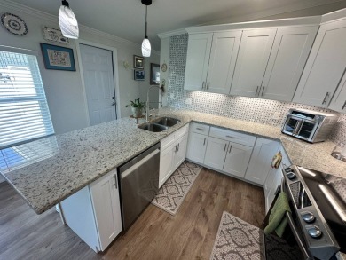 A beautiful remodeled home done in 2022! As you arrive at the on Del Tura Golf and Country Club in Florida - for sale on GolfHomes.com, golf home, golf lot