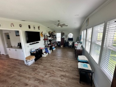 A beautiful remodeled home done in 2022! As you arrive at the on Del Tura Golf and Country Club in Florida - for sale on GolfHomes.com, golf home, golf lot