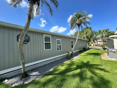 A beautiful remodeled home done in 2022! As you arrive at the on Del Tura Golf and Country Club in Florida - for sale on GolfHomes.com, golf home, golf lot