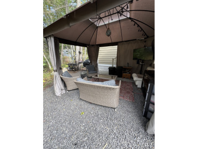 Welcome to your serene escape at Point Sebago. This 2-bedroom on Point Sebago Golf/Beach Resort in Maine - for sale on GolfHomes.com, golf home, golf lot