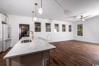 Welcome to your Low Country dream coastal-modern retreat! on True Blue Plantation in South Carolina - for sale on GolfHomes.com, golf home, golf lot