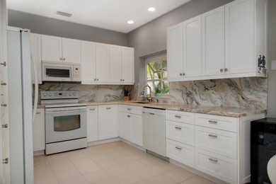 Located in the secure, guard gated community of Indian Springs on Indian Spring Golf and Country Club in Florida - for sale on GolfHomes.com, golf home, golf lot