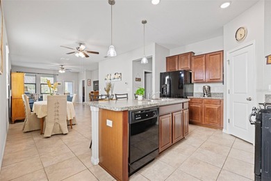 LOVE WHERE YOU LIVE! This turnkey 3-bedroom, 2-bath home offers on The Groves Golf and Country Club in Florida - for sale on GolfHomes.com, golf home, golf lot