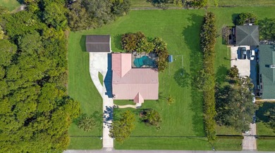Live the lifestyle you've been dreaming of in this impressive on Jupiter Country Club in Florida - for sale on GolfHomes.com, golf home, golf lot