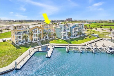 Wowza!! Fly in and enjoy your waterfront 4 story pristine, 3/3.5 on Palmilla Beach Golf Club in Texas - for sale on GolfHomes.com, golf home, golf lot