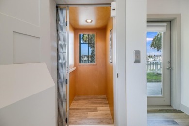 Wowza!! Fly in and enjoy your waterfront 4 story pristine, 3/3.5 on Palmilla Beach Golf Club in Texas - for sale on GolfHomes.com, golf home, golf lot