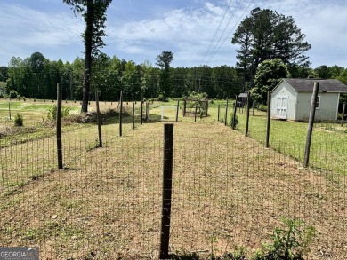 This beautifully renovated ranch-style home, located in a on Summergrove Golf Club in Georgia - for sale on GolfHomes.com, golf home, golf lot