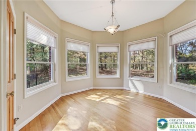 Experience refined luxury and serene privacy in this exceptional on Caesars Pocono Palace Resort in Pennsylvania - for sale on GolfHomes.com, golf home, golf lot