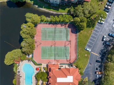 Under contract-accepting backup offers. Stylish 2BR/1BA Condo in on Feather Sound Country Club in Florida - for sale on GolfHomes.com, golf home, golf lot