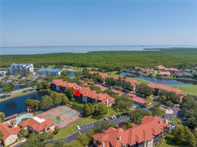 Under contract-accepting backup offers. Stylish 2BR/1BA Condo in on Feather Sound Country Club in Florida - for sale on GolfHomes.com, golf home, golf lot