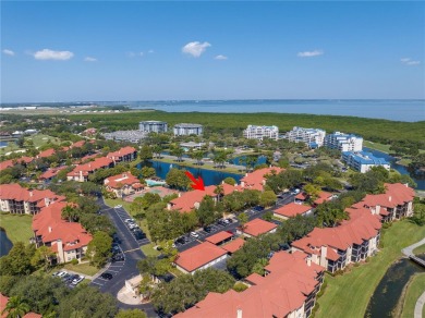Under contract-accepting backup offers. Stylish 2BR/1BA Condo in on Feather Sound Country Club in Florida - for sale on GolfHomes.com, golf home, golf lot