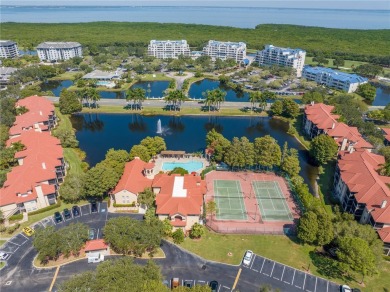 Under contract-accepting backup offers. Stylish 2BR/1BA Condo in on Feather Sound Country Club in Florida - for sale on GolfHomes.com, golf home, golf lot