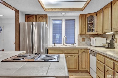 Love where you live in this beautifully maintained end-unit on LakeRidge Golf Course in Nevada - for sale on GolfHomes.com, golf home, golf lot