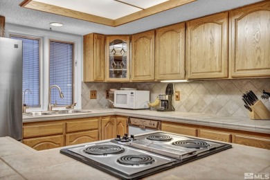 Love where you live in this beautifully maintained end-unit on LakeRidge Golf Course in Nevada - for sale on GolfHomes.com, golf home, golf lot