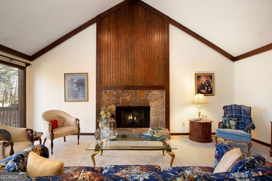 Tucked among mature trees and backing to the Rivermont golf on Rivermont Golf and Country Club in Georgia - for sale on GolfHomes.com, golf home, golf lot