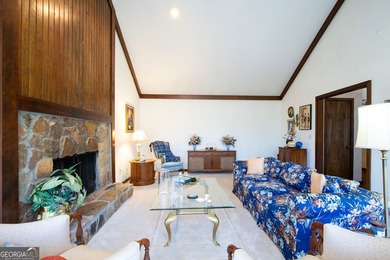 Tucked among mature trees and backing to the Rivermont golf on Rivermont Golf and Country Club in Georgia - for sale on GolfHomes.com, golf home, golf lot