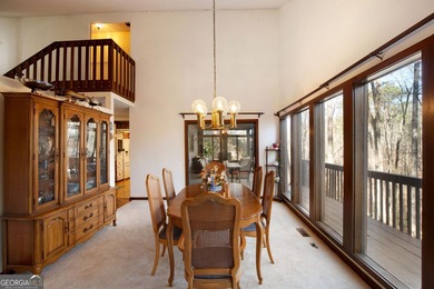 Tucked among mature trees and backing to the Rivermont golf on Rivermont Golf and Country Club in Georgia - for sale on GolfHomes.com, golf home, golf lot