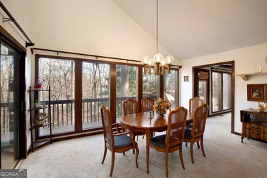 Tucked among mature trees and backing to the Rivermont golf on Rivermont Golf and Country Club in Georgia - for sale on GolfHomes.com, golf home, golf lot