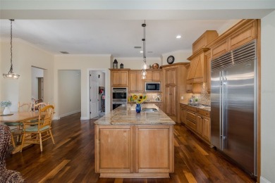 CHAMPIONS CLUB Luxury Bayfair Custom built home tucked behind on Fox Hollow Golf Club in Florida - for sale on GolfHomes.com, golf home, golf lot